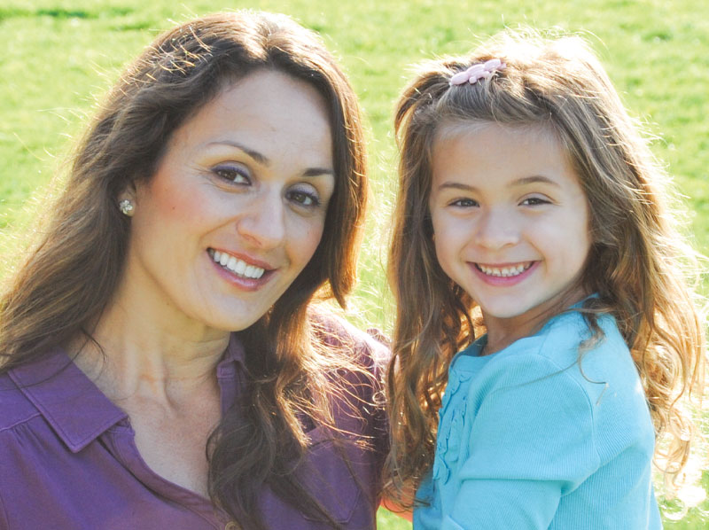 Mother and her daughter with big smiles.